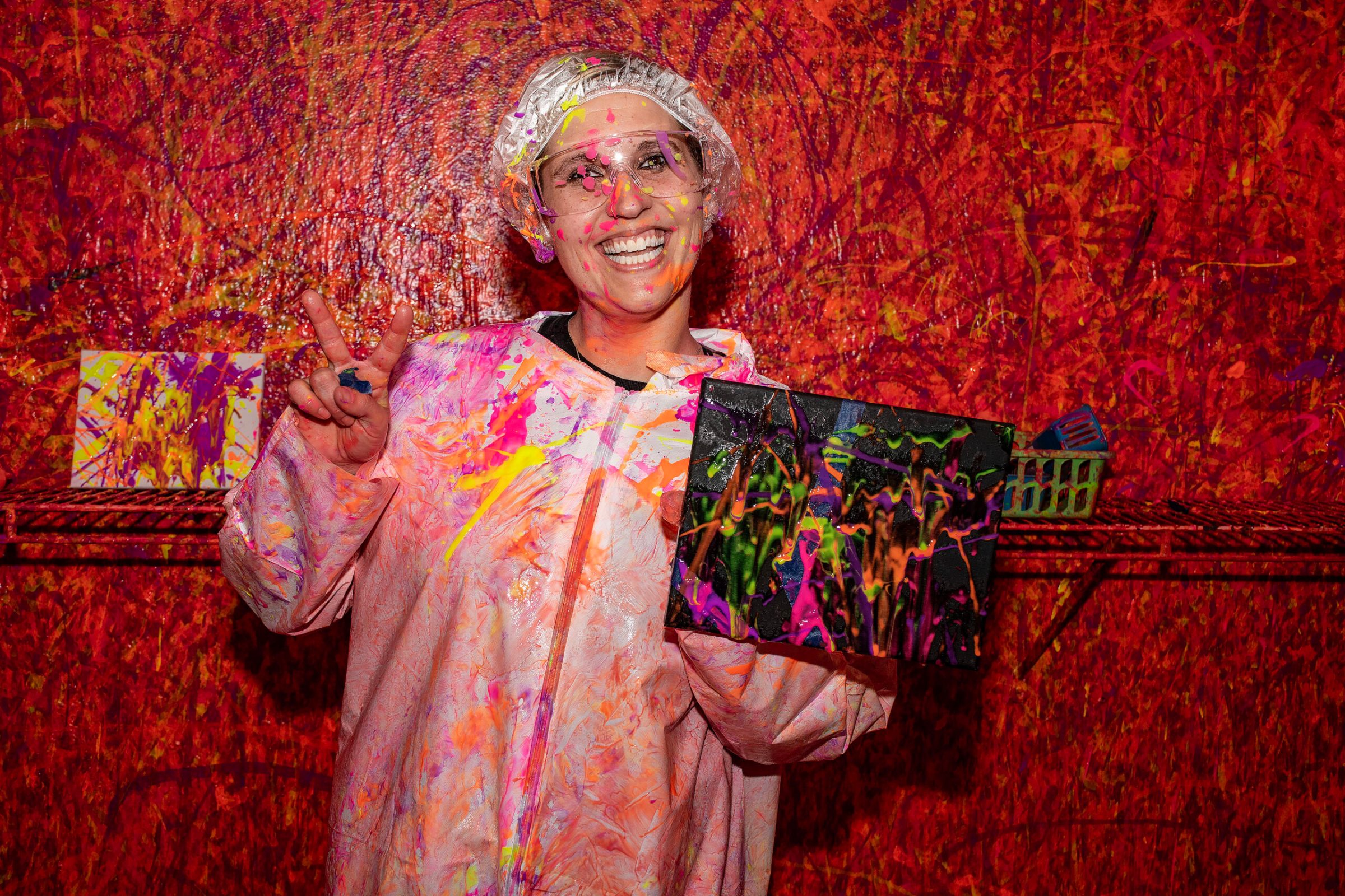 a person wearing colorful clothes and smiling at the camera